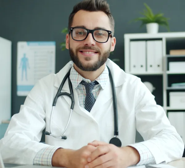 Doctor in a white coat on the video visit